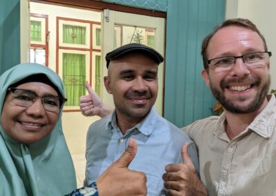 Lily, Halik and Lev giving thumbs up in Lily's dean office